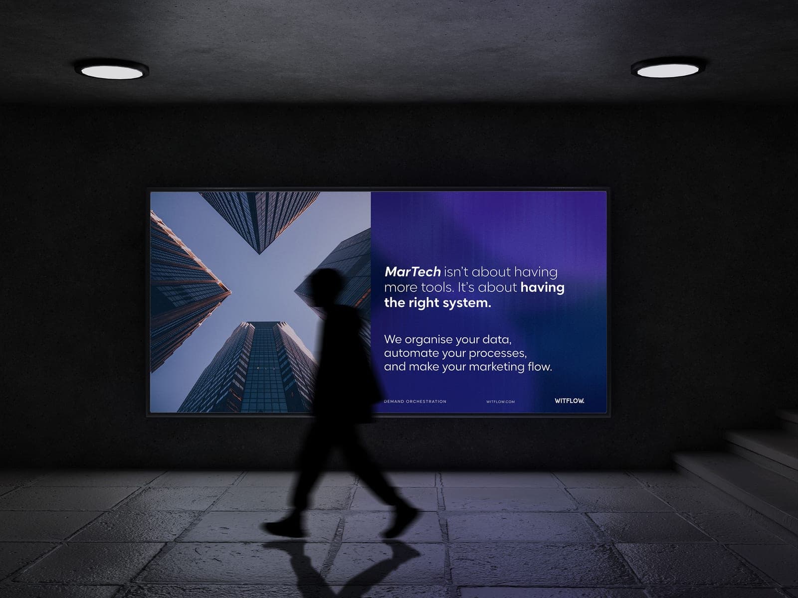 Person walking through a metro station with WitFlow advertising, value delivered on the move